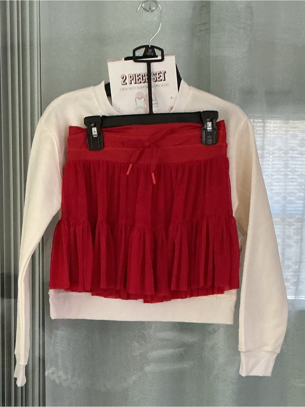 2 Piece Set that includes a crewneck sweatshirt and a matching mini skort